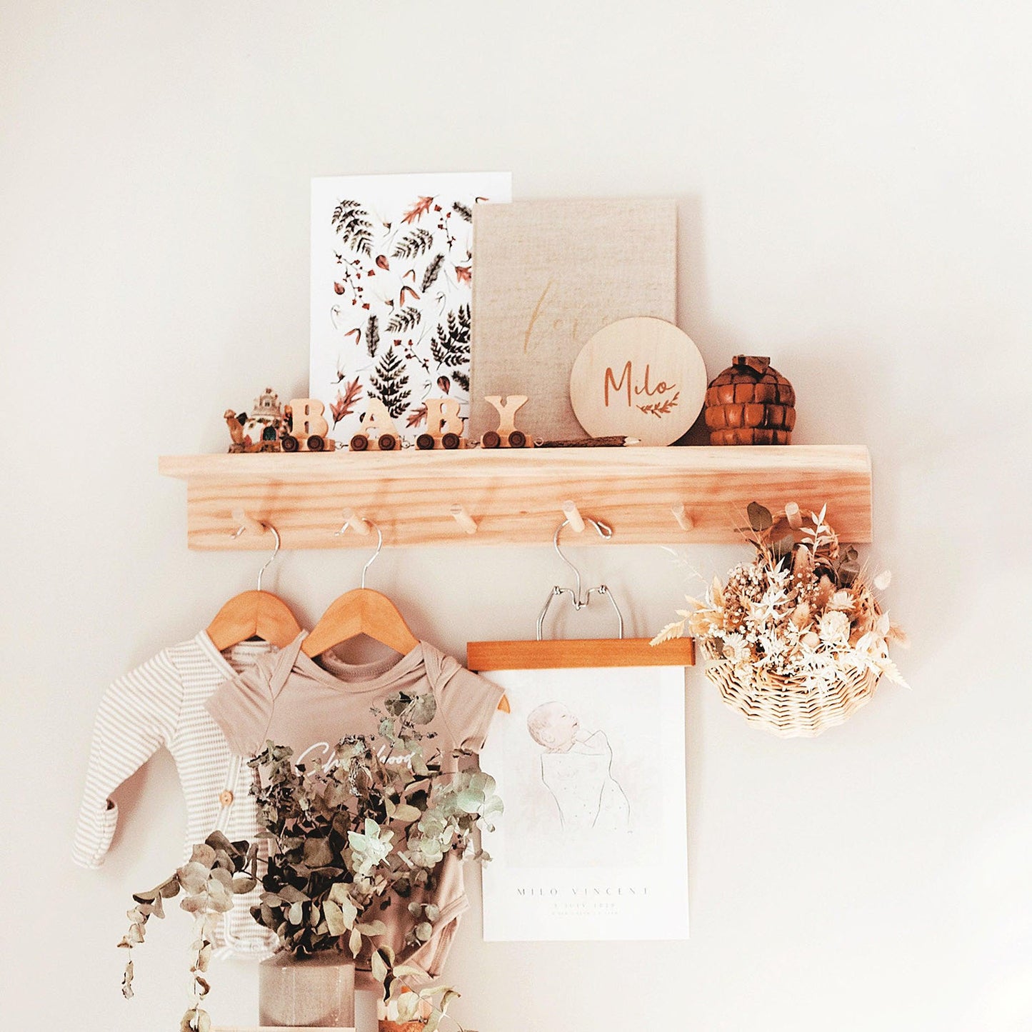 This is a pine wood nursery shelf where you can display in your baby's nursery room