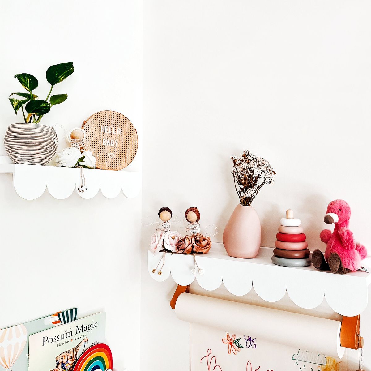 This is our scallop shelf in white to display decorations or photo frames.