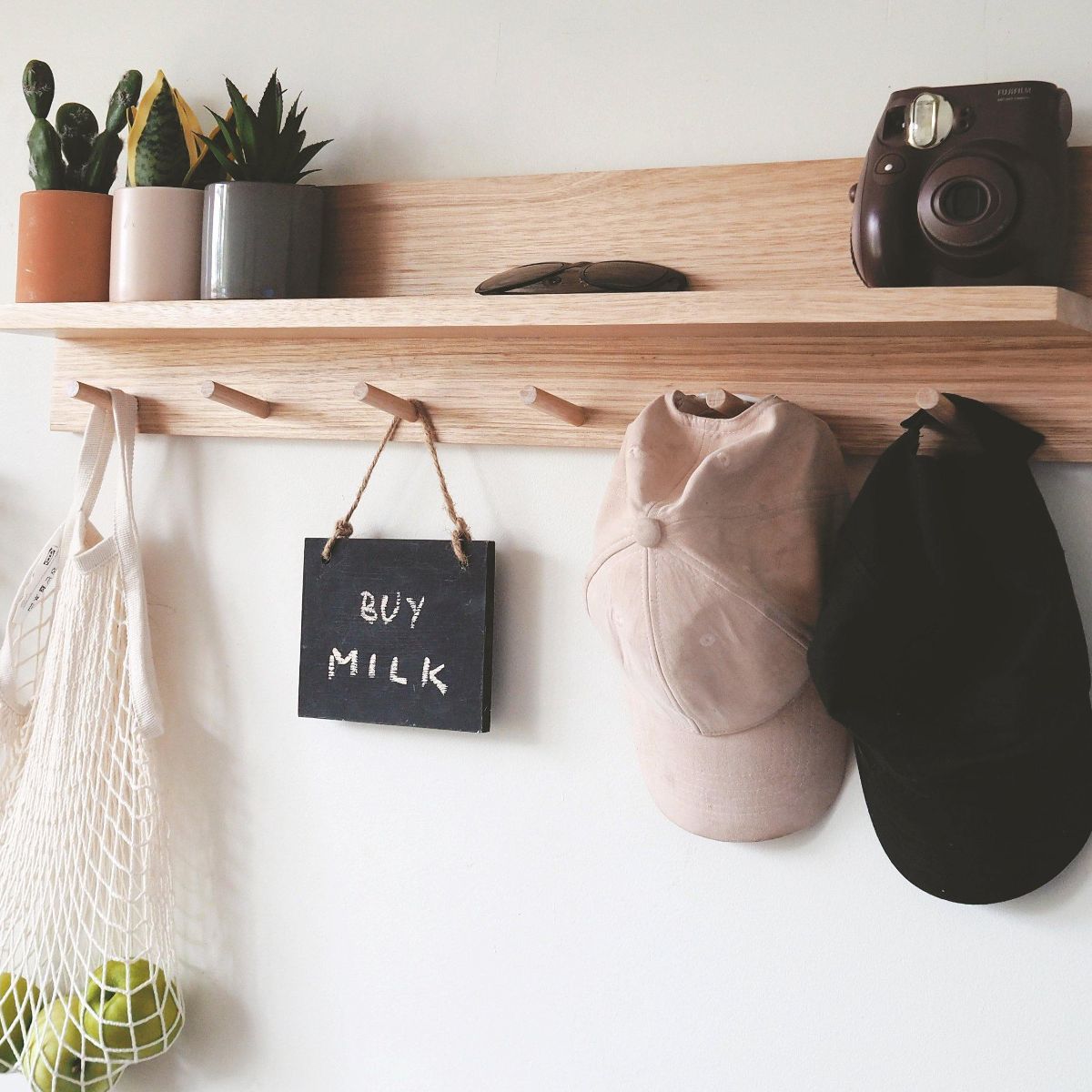 This is an 80cm Tasmanian Oak Entryway Shelf Organiser with a wider spaced 6 pegs for bigger items to hang. This is the side view of the shelf