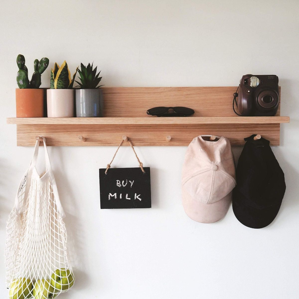This is an 80cm Tasmanian Oak Entryway Shelf Organiser with a wider spaced 6 pegs for bigger items to hang