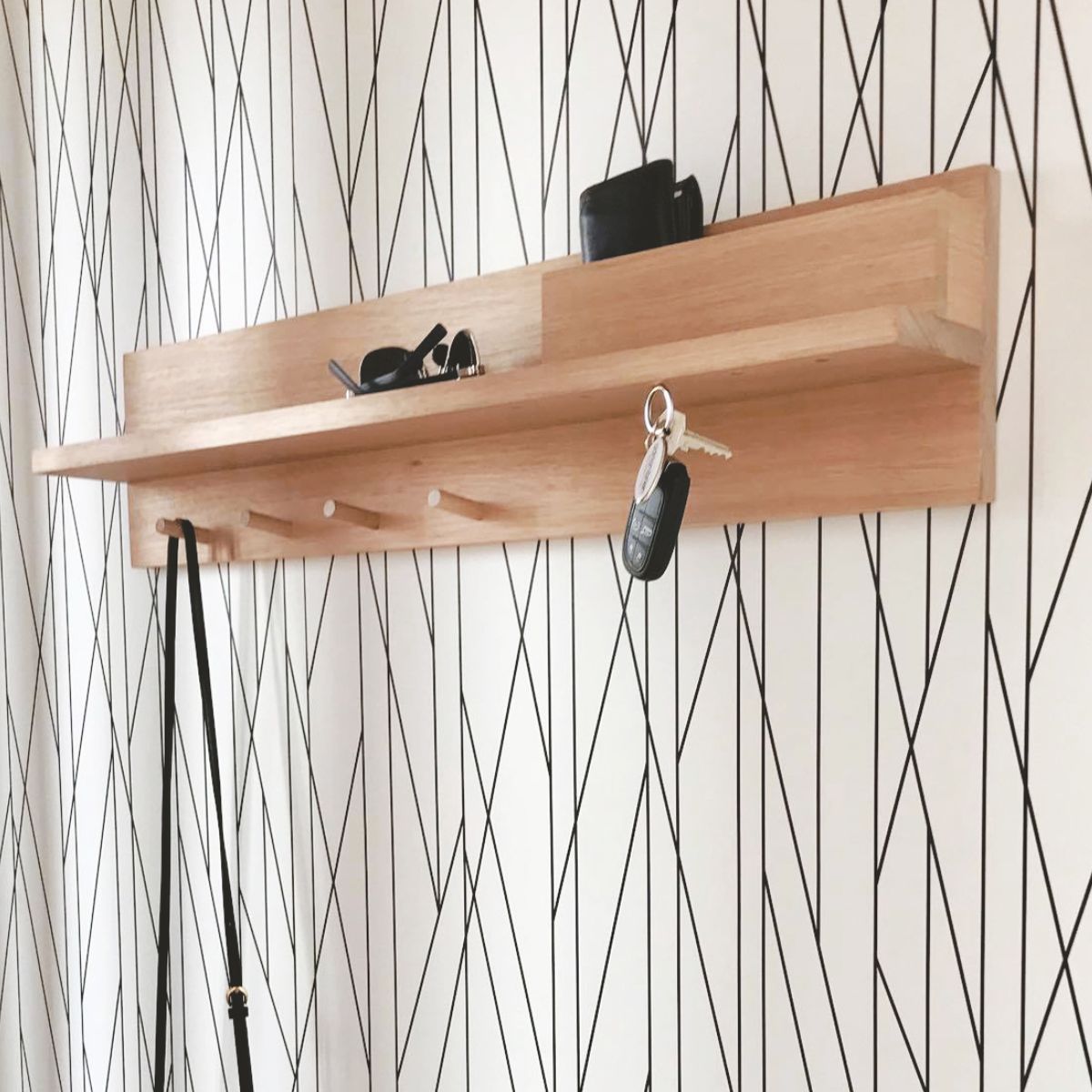 Entryway Shelf with mail holder, coat pegs and magnetic key holders on a wall