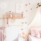 This is a pine wood nursery shelf where you can display in your little girl's room